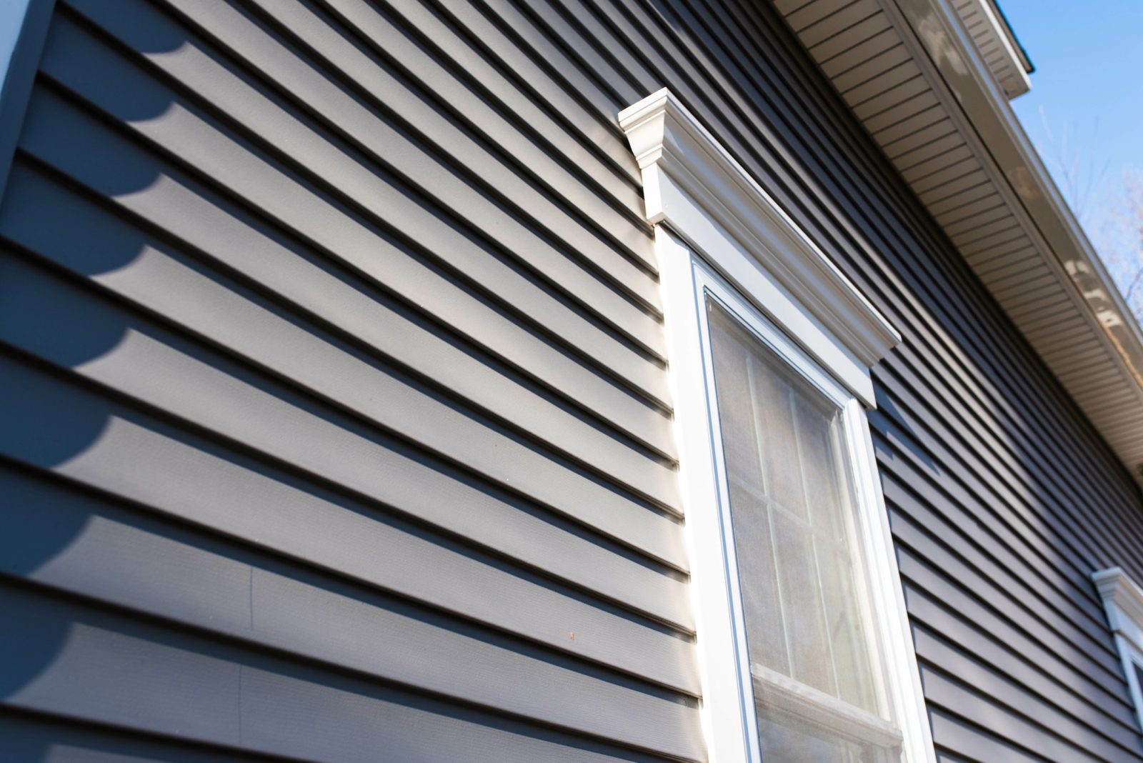 Close-up of vinyl siding and window trim on a home